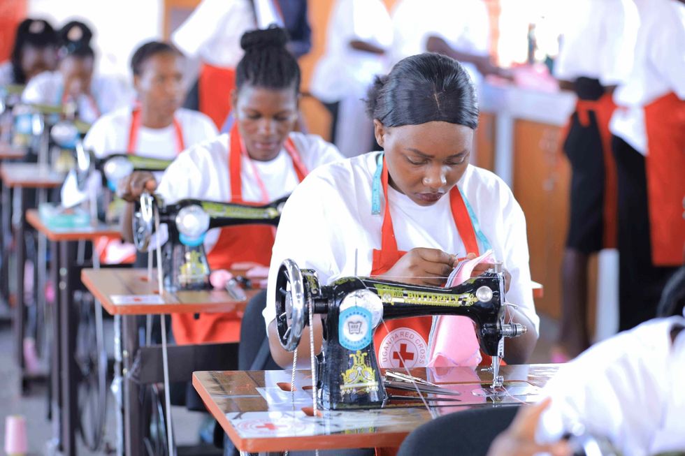 3 Newly trained staff working at manufacturing plant