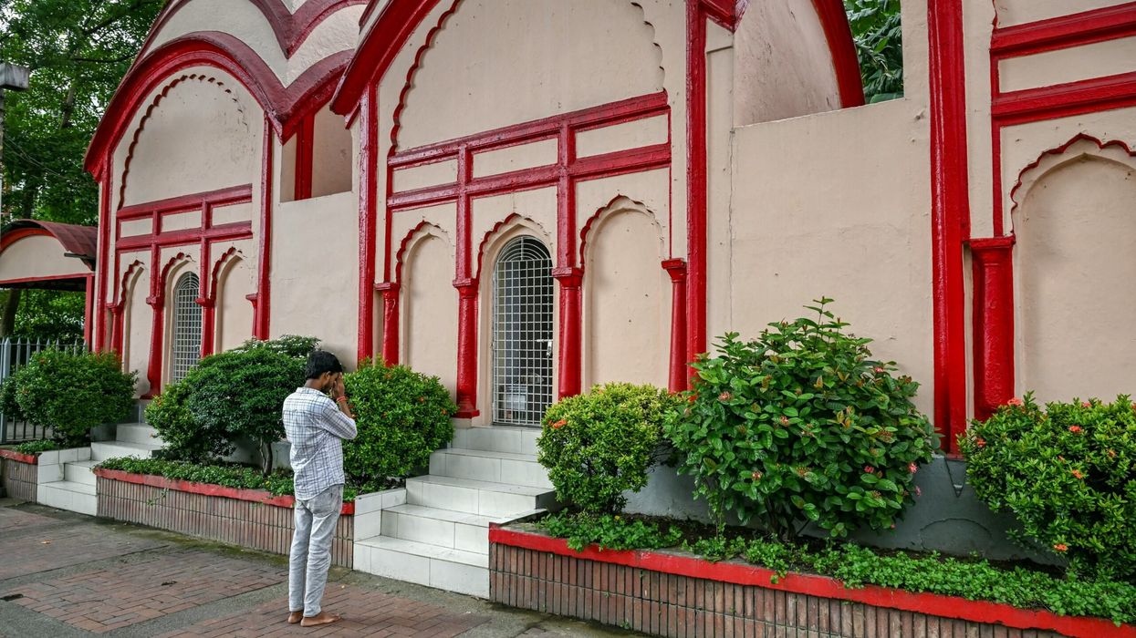 A Hindu devotee offers prayers at the Dhakeshwari National Temple in Dhaka on August 9, 2024, days after a student-led uprising that ended the rule of ousted premier Sheikh Hasina. (Photo: Getty Images)