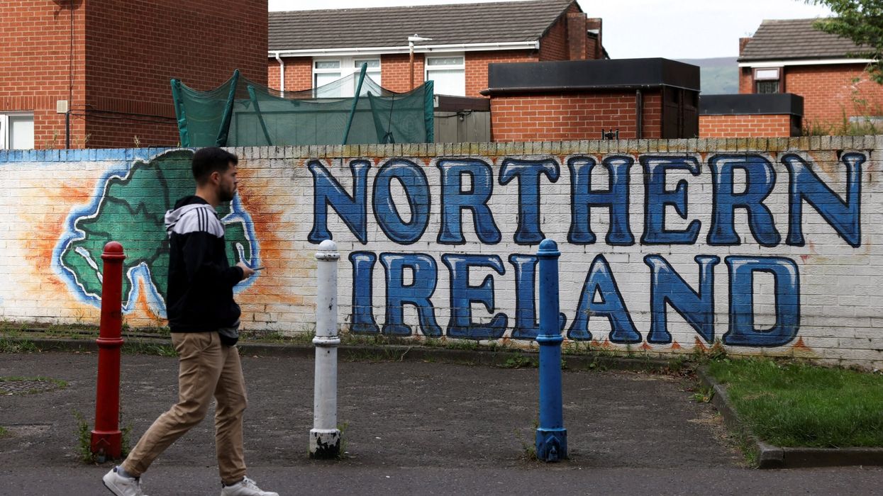 A man walks past a mural that says ‘Northern Ireland’, on Sandy Row in Belfast, Northern Ireland, August 11, 2024. (Photo: Reuters)