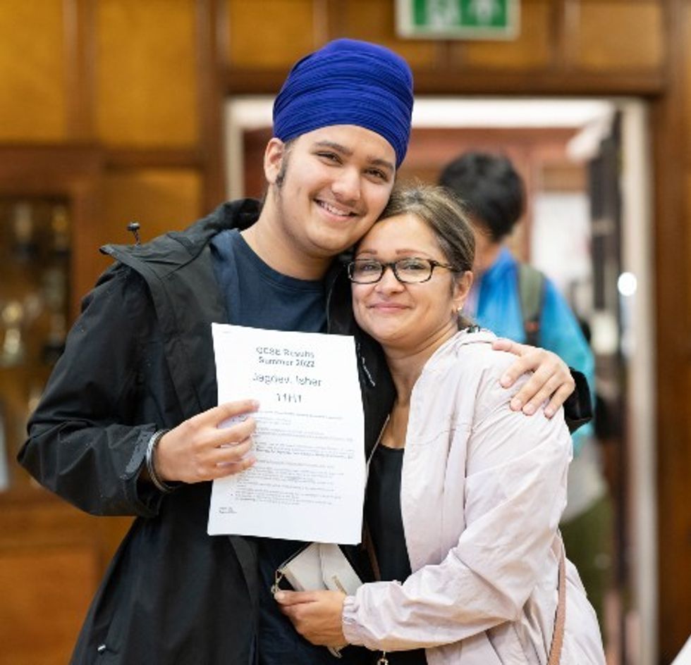 A student displays his GCSE