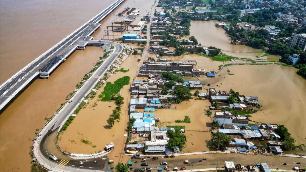 An aerial view shows houses partially submerged in flood, after rise in water level of river Ganges, in India's Patna on September 20, 2024. (Photo: Getty Images)