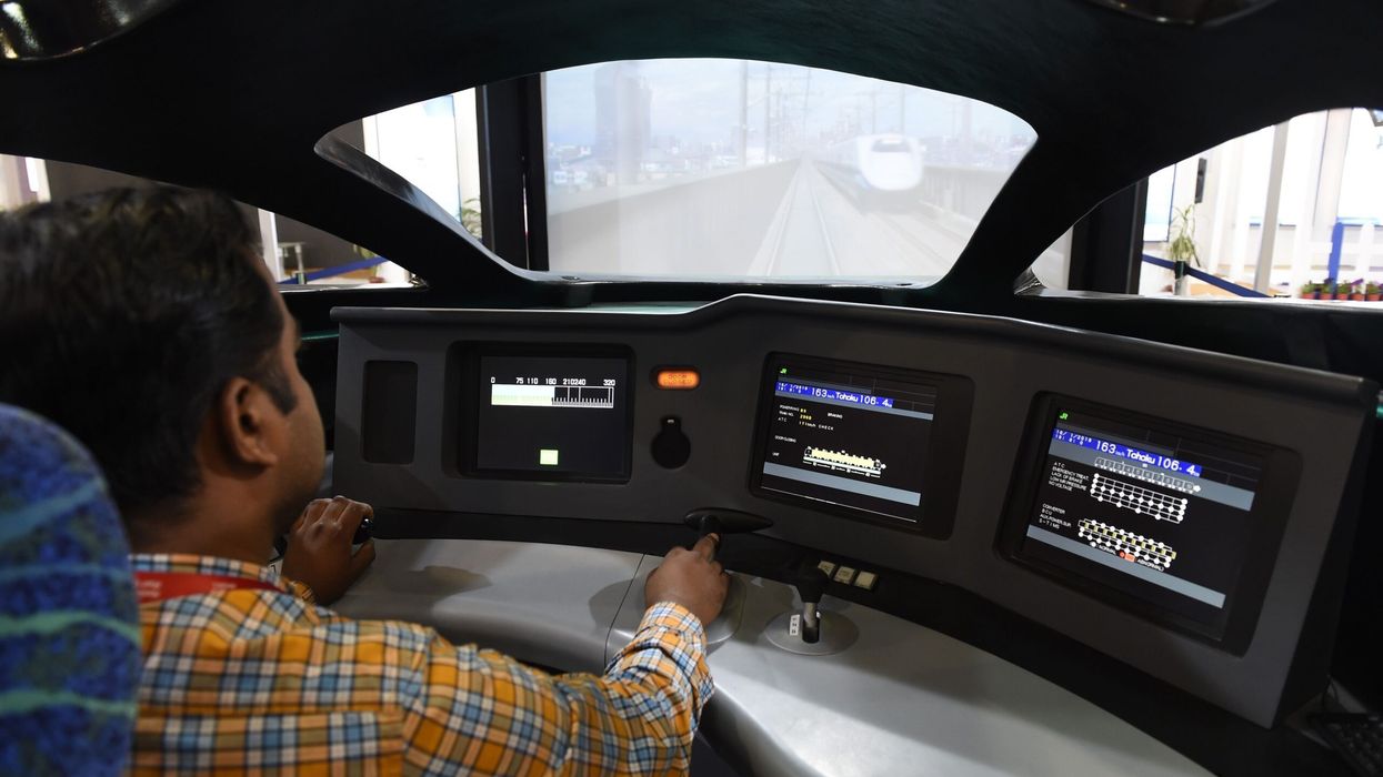 An Indian officer from the National High-Speed Rail Corporation Ltd (NHSRCL) tests a bullet train simulator on the eve of Vibrant Gujarat Global Trade Show at Gandhinagar, some 30 km from Ahmedabad on January 16, 2019. (Photo: Getty Images)