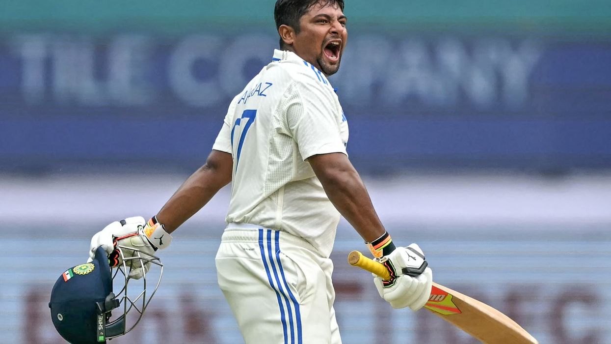 arfaraz Khan celebrates after scoring a century during the fourth day of the first Test against New Zealand in Bengaluru. (Photo: Getty Images)