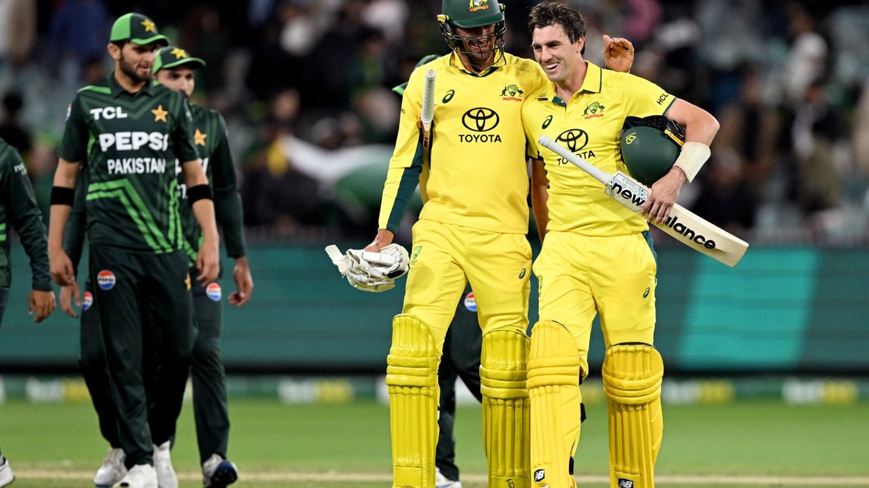 Australia's Pat Cummins (R) is congratulated by teammate Mitchell Starc after hitting the winning run during the first ODI between Australia and Pakistan at the Melbourne Cricket Ground (MCG) in Melbourne on November 4, 2024. (Photo: Getty Images)