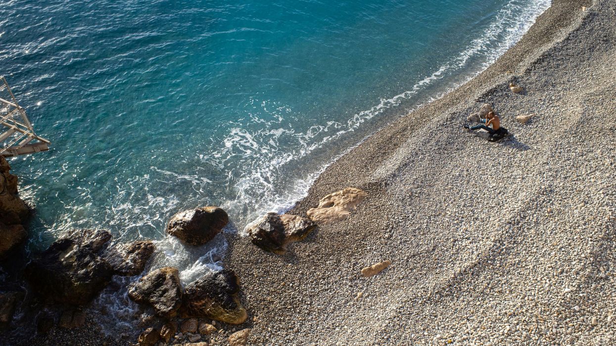 Drone Shot of Waves Washing Up the Beach in Nice