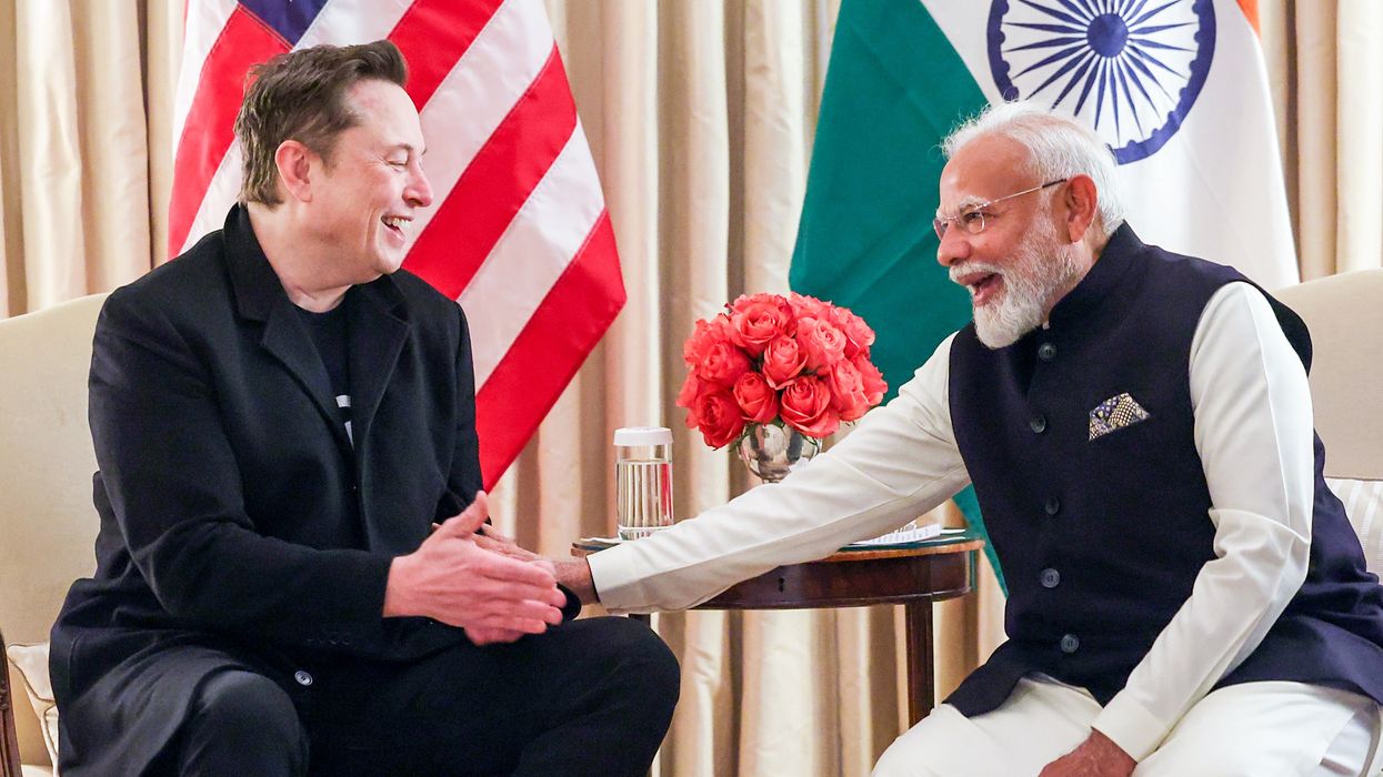Elon Musk and Narendra Modi (right)