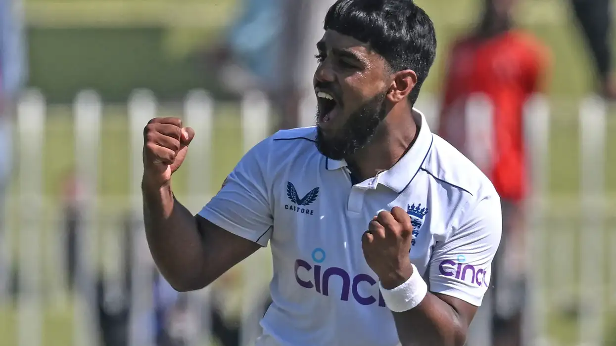 England's Rehan Ahmed celebrates after taking the wicket of Pakistan's Salman Agha during the second day of the third and final Test in Rawalpindi on October 25, 2024. (Photo: Getty Images)
