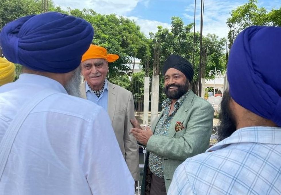Entrepreneur Sukhpal Singh Ahluwalia (C) donates 25000 pounds to Museum in Lewisham