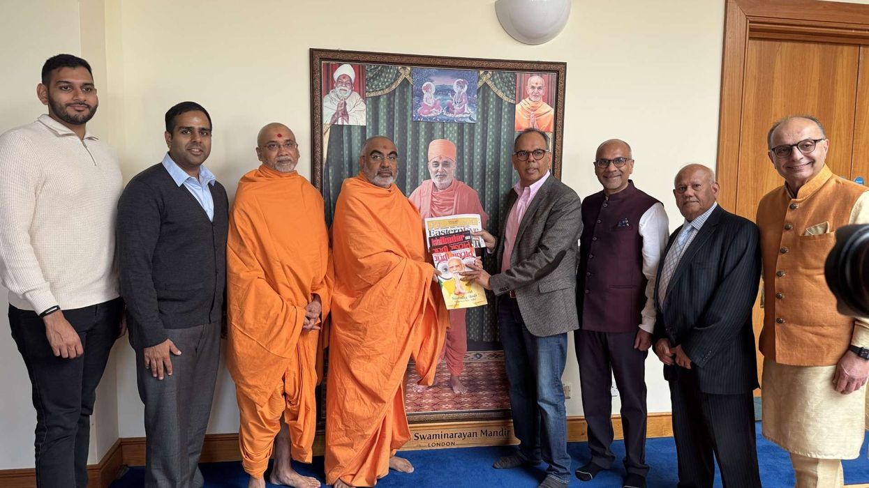 AMG team meets BAPS head priest during Hindu New Year celebrations