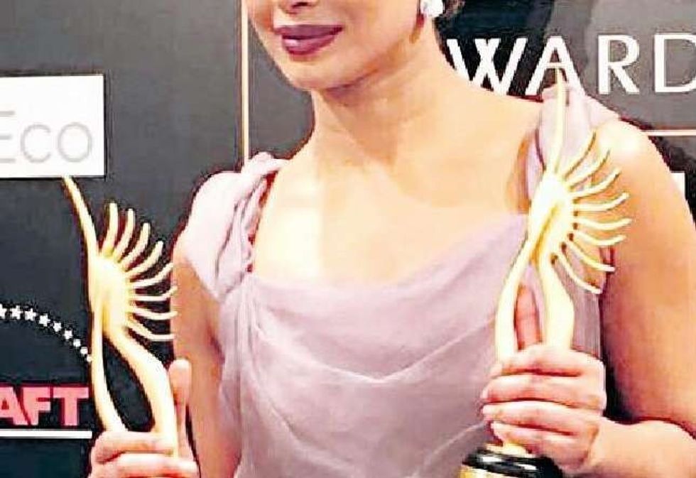 GONGS AWAY: Best Supporting Actress Priyanka Chopra; and (left) Best Actor Ranveer Singh with Best Actress Deepika Padukone