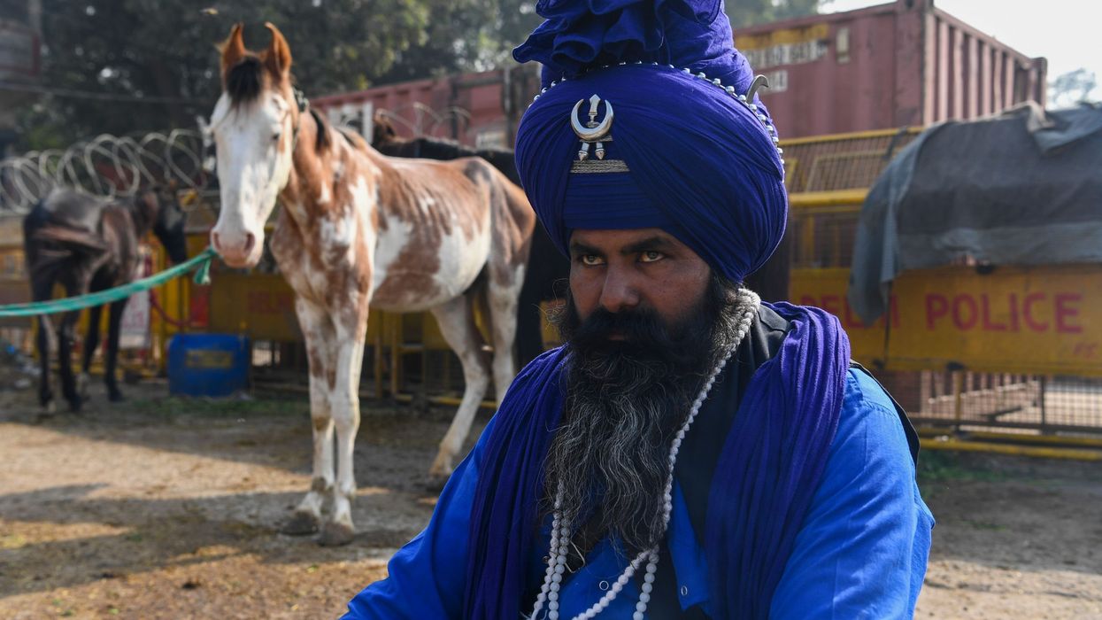 India's sword-wielding Sikh warriors guard protesting farmers