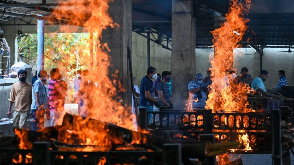 India's daily Covid infections hit 332,730; health system staggers