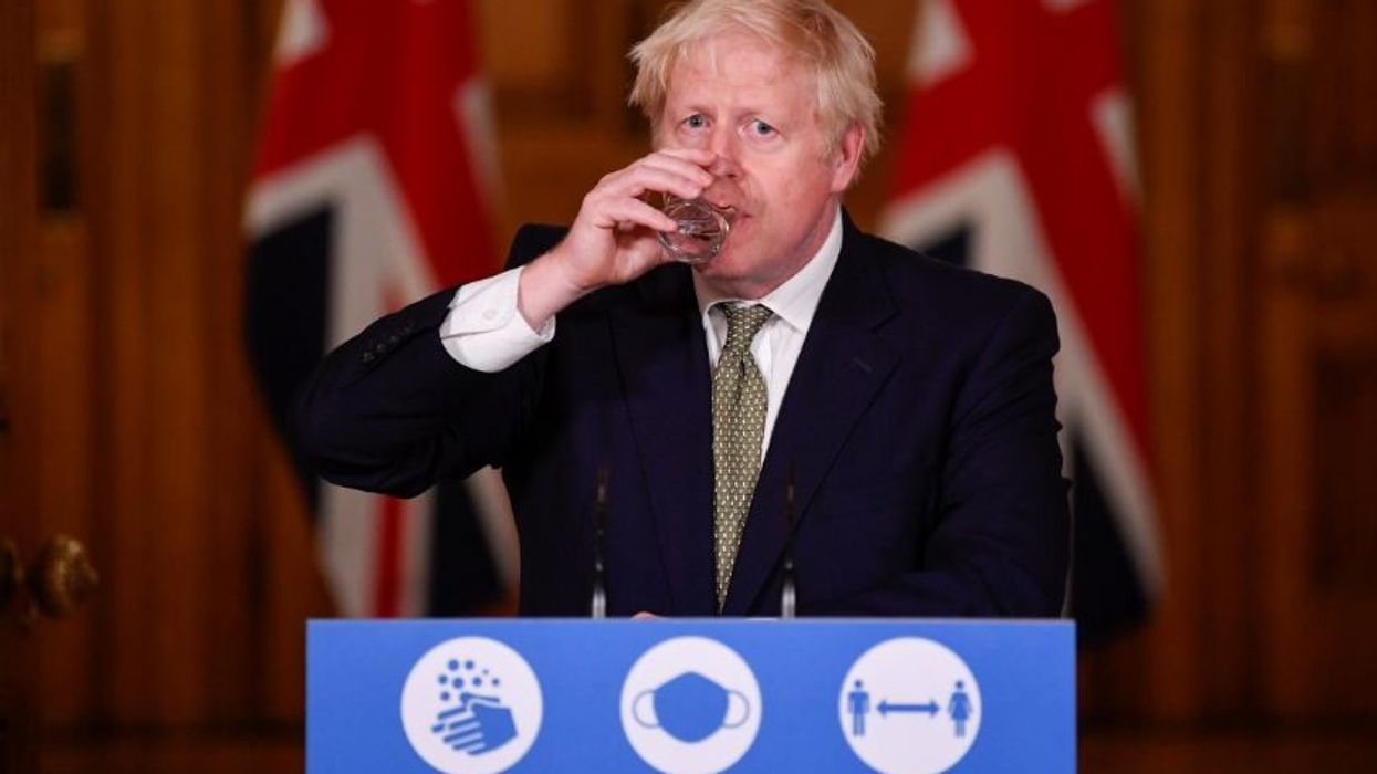 UK denies report that Johnson said 'let the bodies pile high'