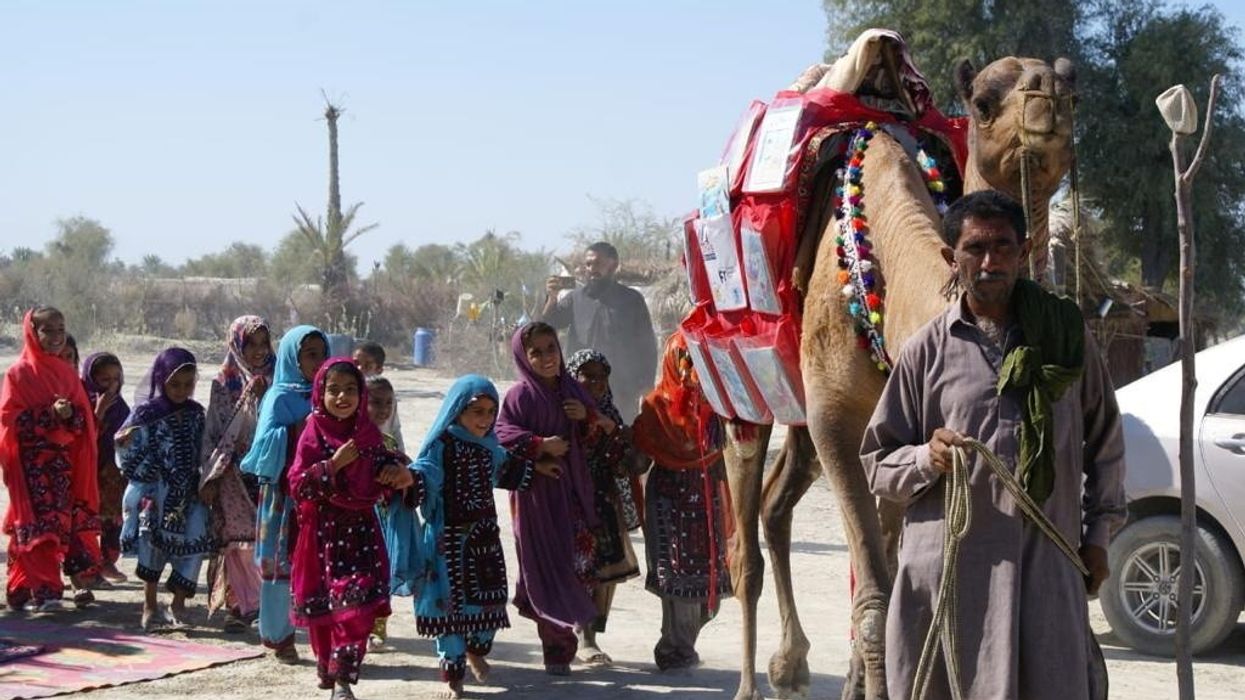 Roshan the camel brings books to homeschooling children in rural Pakistan