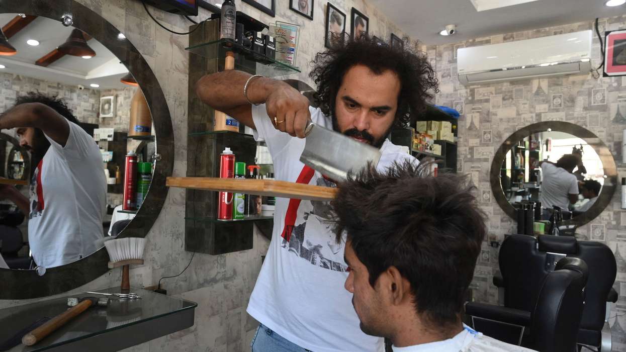 This Pakistan barber uses torch, meat cleaver to give hair cut