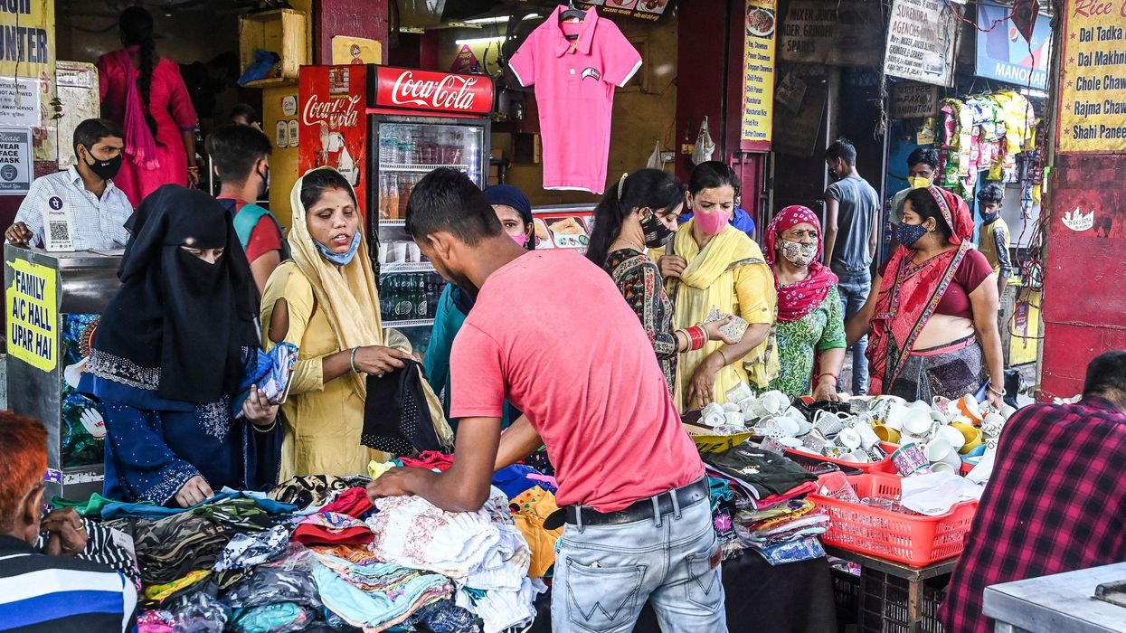 'Cooped up' Indians throng malls and markets weeks after Covid surge