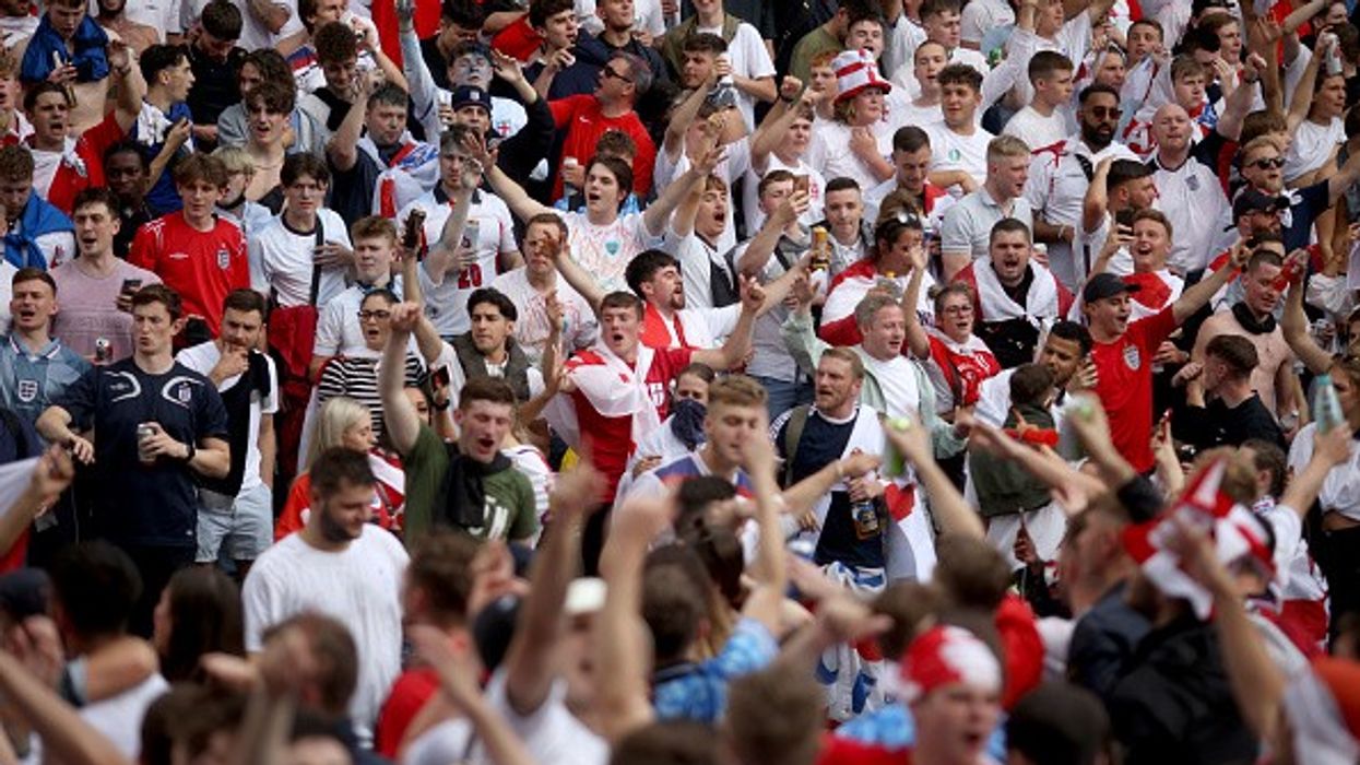 Asian man kicked, punched at Wembley as football fans go on violent rampage