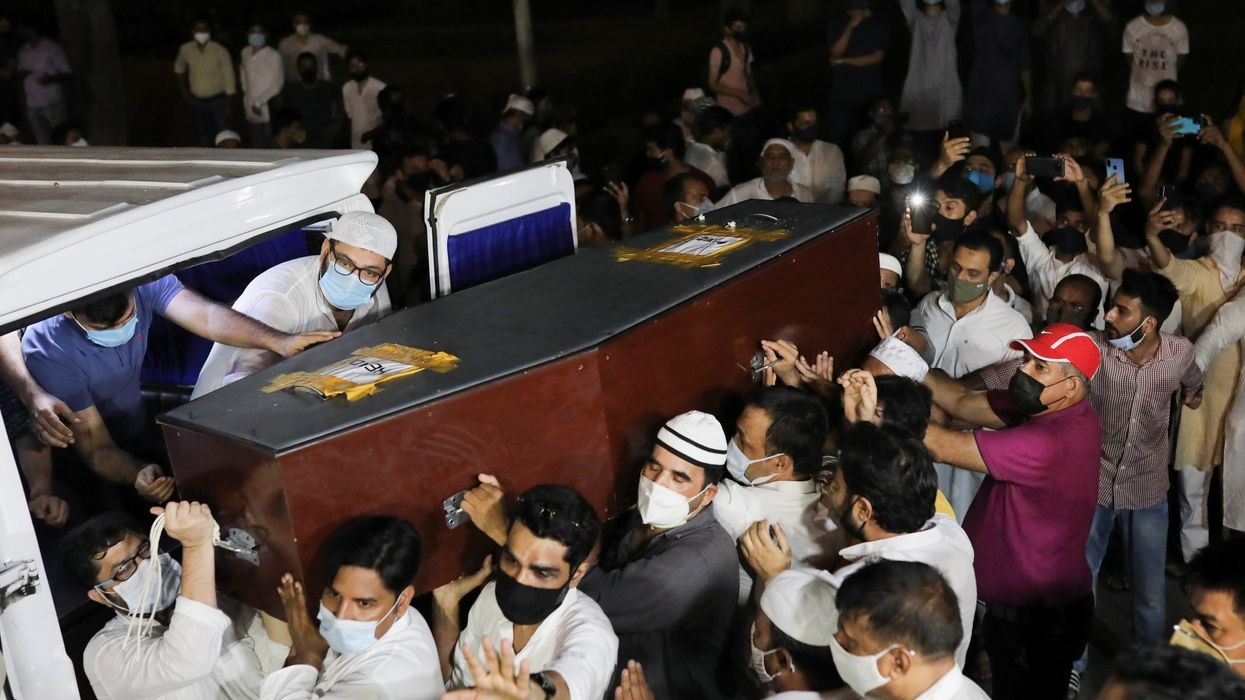 Body of photojournalist returns to India, hundreds attend funeral