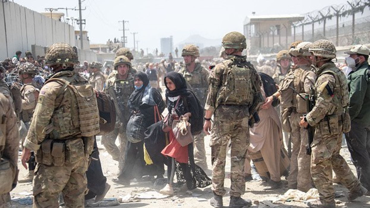 Seven died near Kabul airport as UK races against time in chaotic evacuation