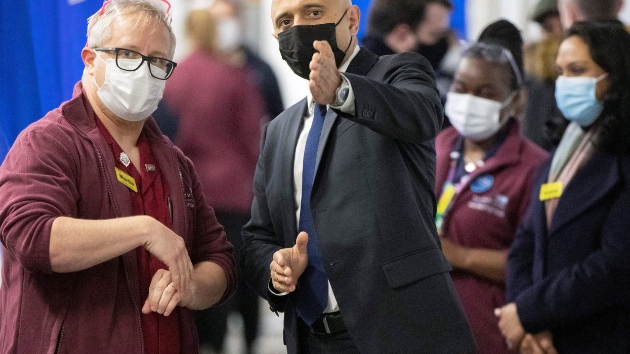 UK urges people to take booster shots as Omicron cases grow