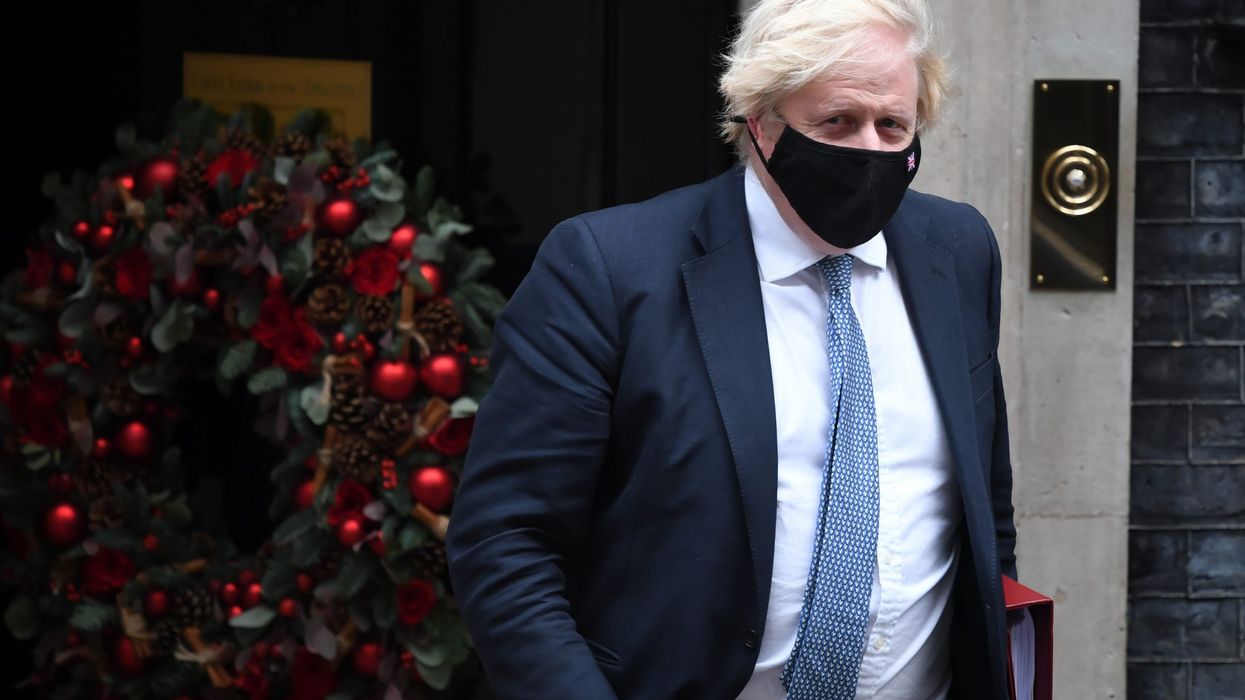 Johnson warns of Omicron 'tidal wave', says two doses not enough