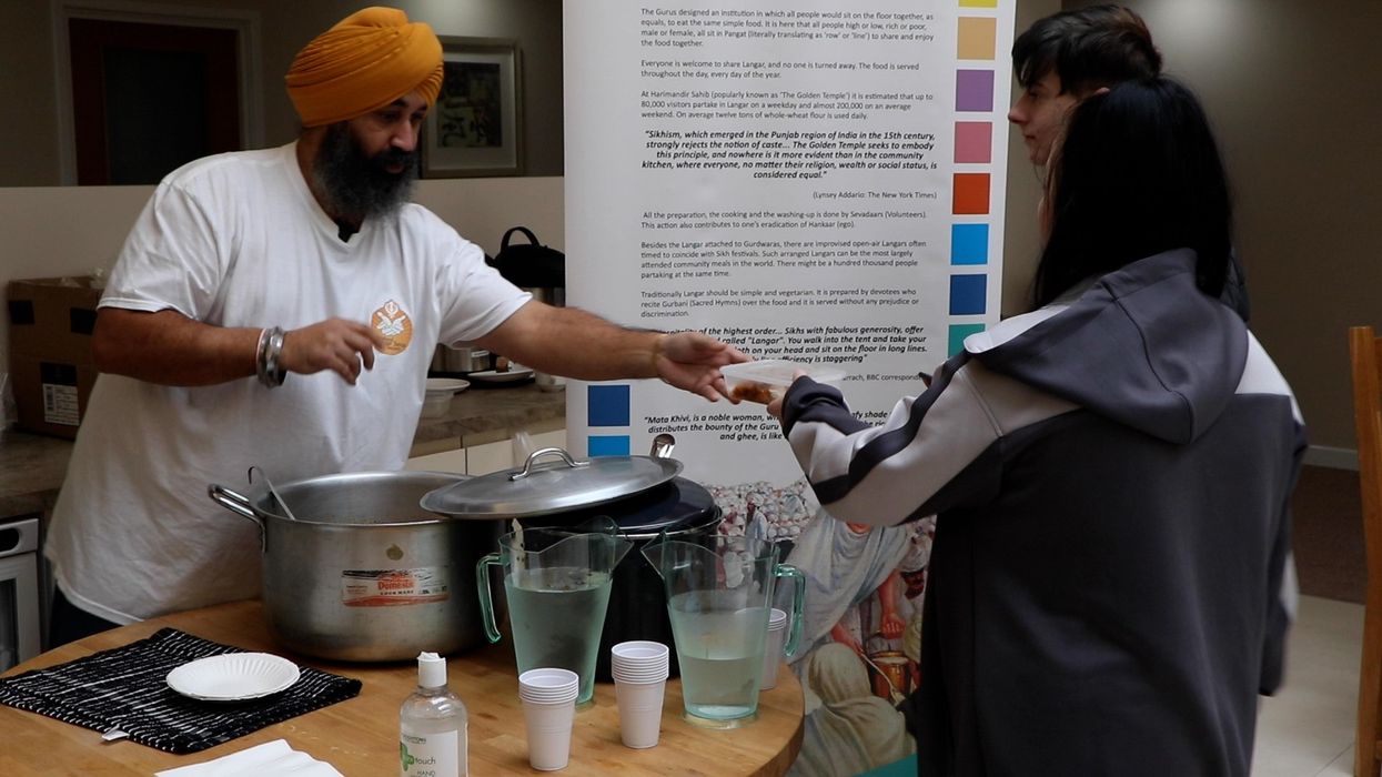 Plymouth councillor helps distribute free food