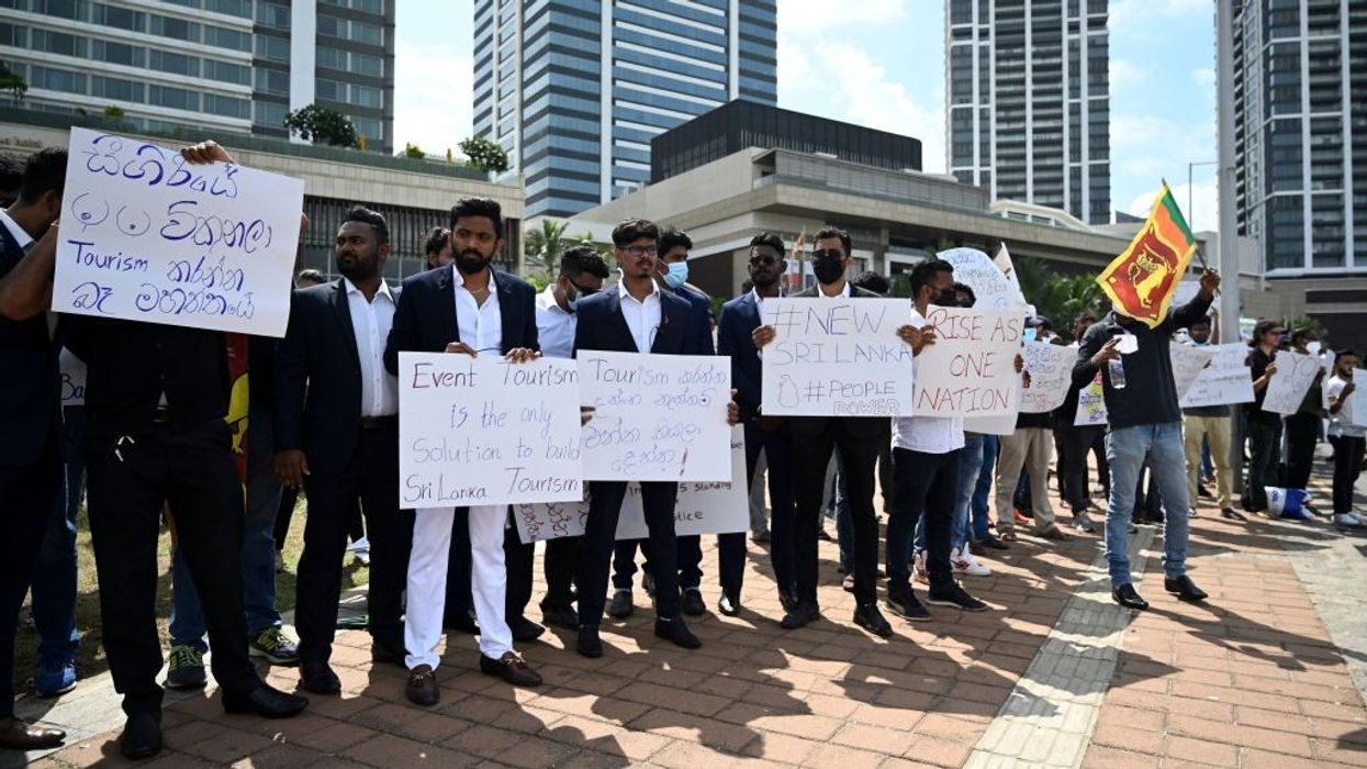 Crisis-hit Sri Lanka hikes rates as protests spiral