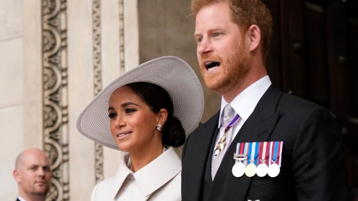 Cheers and some jeers as Prince Harry and Meghan return to UK