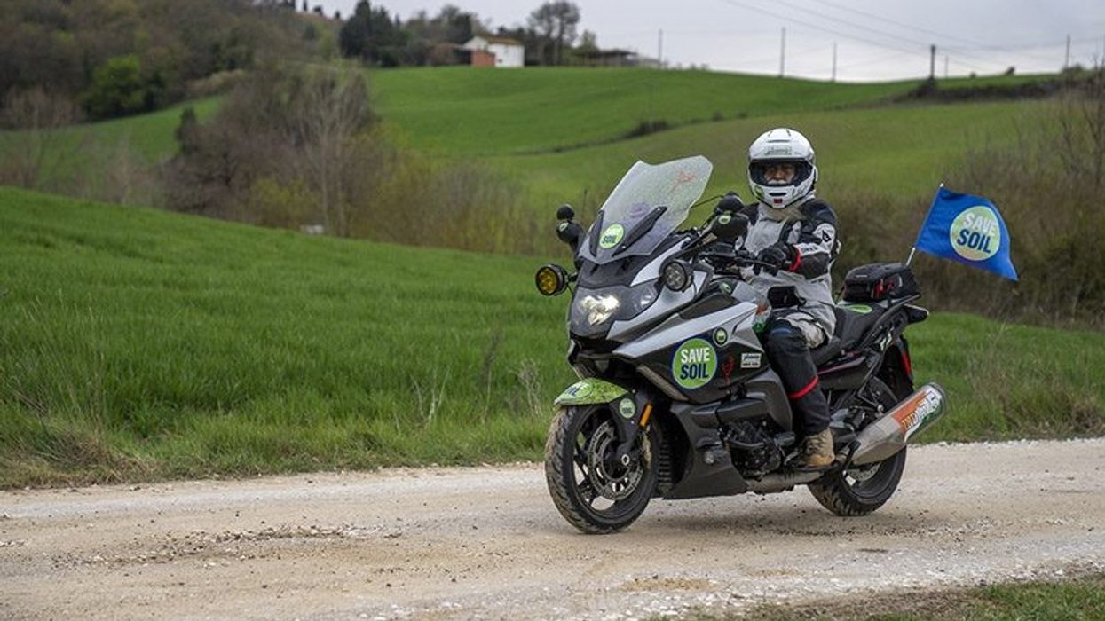 Why did Sadhguru choose to ride a bike for the 'Save Soil' campaign?
