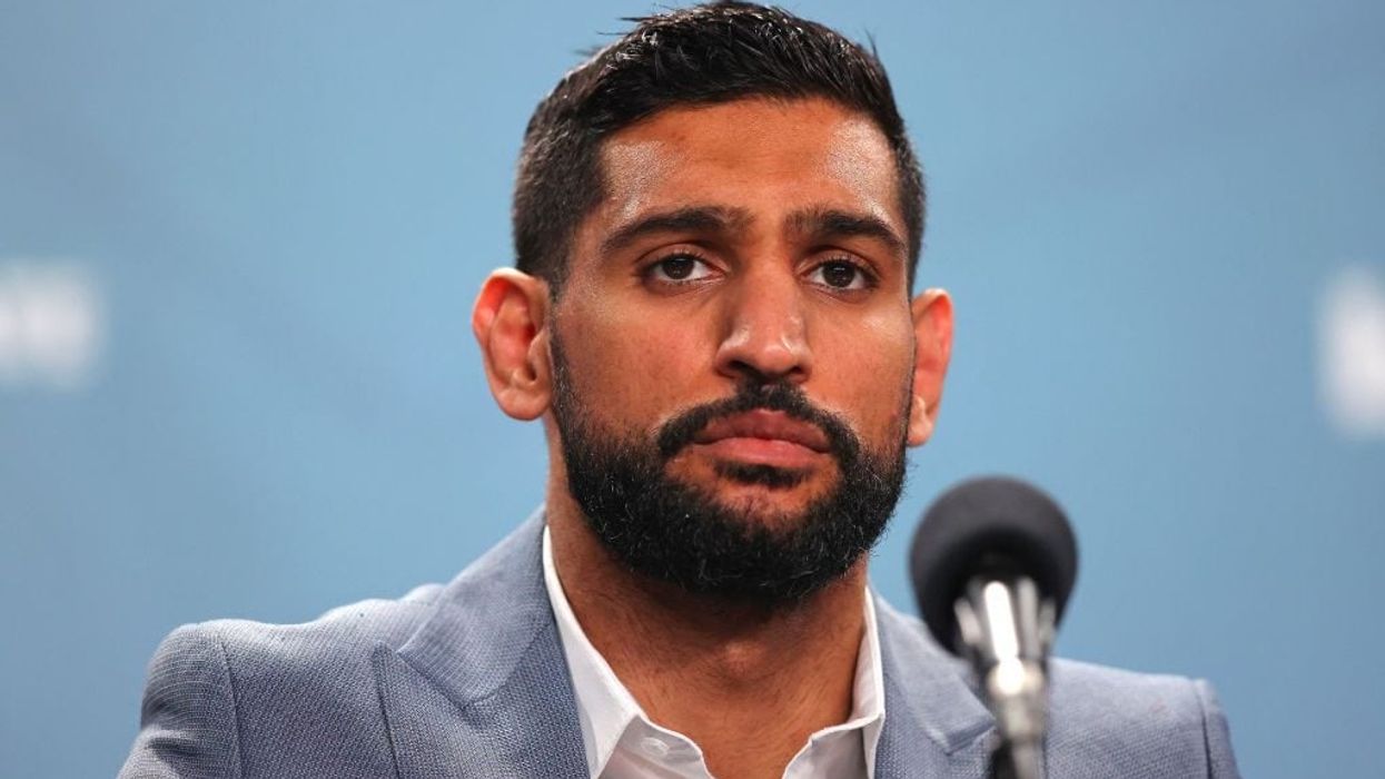 Three men charged over robbery of former world boxing champion Amir Khan