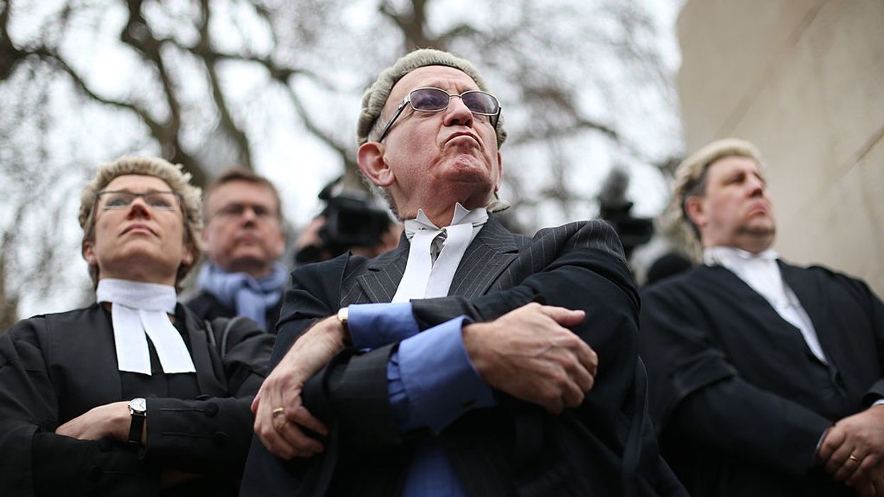 Britain's trial lawyers stage walkouts over legal aid funding; teachers and health workers also contemplating strikes