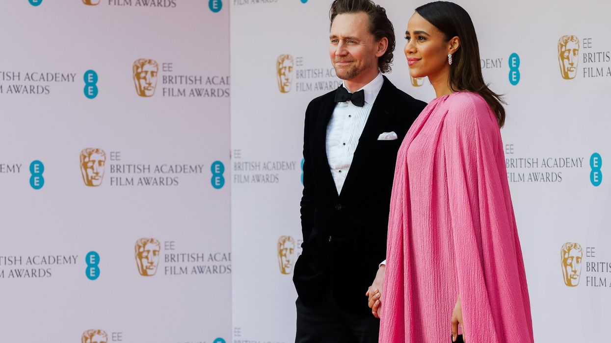 Tom Hiddleston and Marvel star Zawe Ashton expecting first baby together; the actress debuts baby bump at premiere