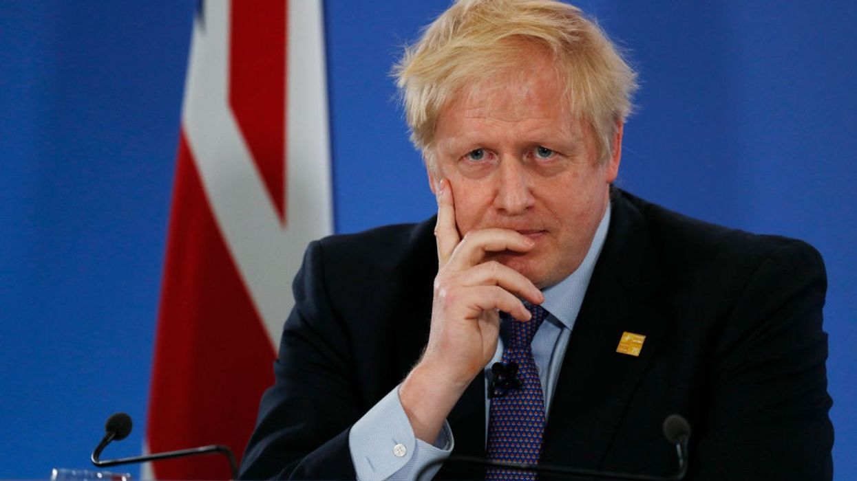 Boris Johnson clings on despite clamour for his resignation