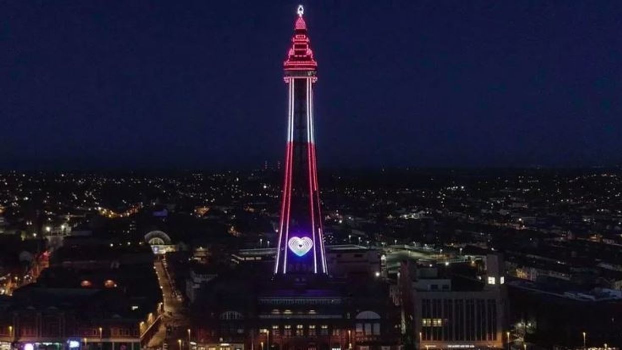 Blackpool Tower lit up in red and white to honour Pramukh Swami Maharaj