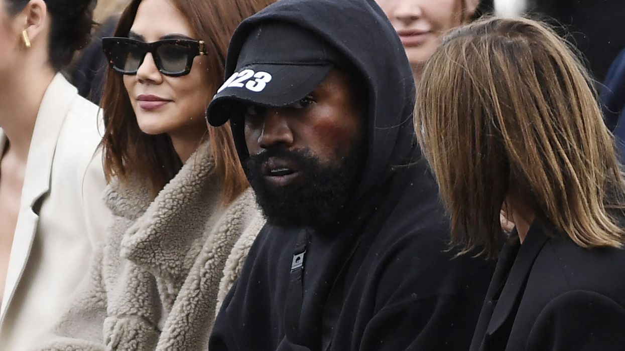Kanye West takes everyone by surprise as he makes his runway debut in Balenciaga’s muddy Paris Fashion Week Show
