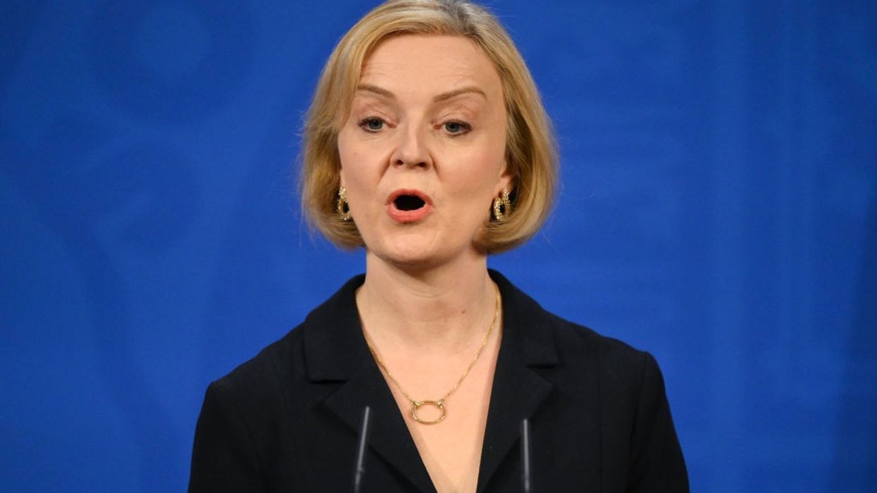 Truss sacrifices finance minister, scraps tax plan in fight to survive