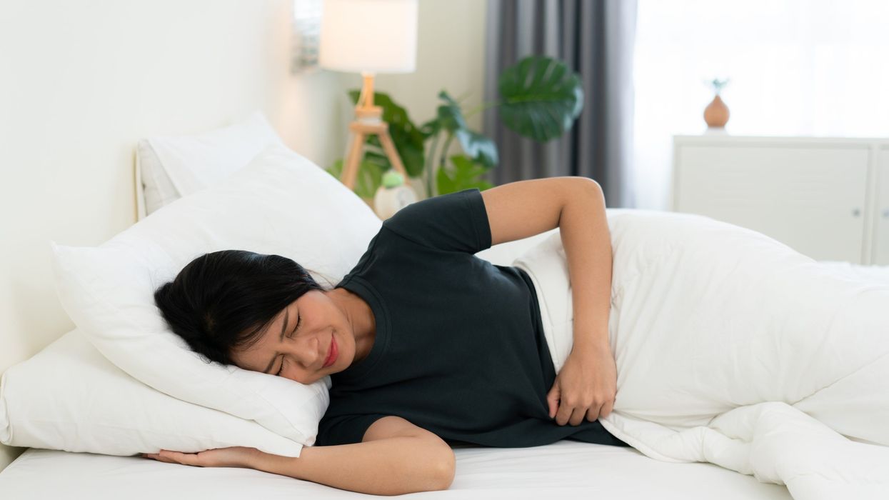 What is the best sleeping position to aid digestion?
