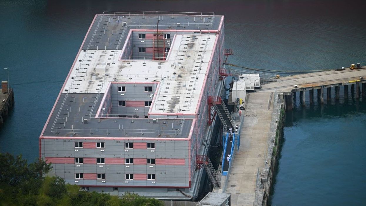 Bacteria in water prompts removal of migrants from barge