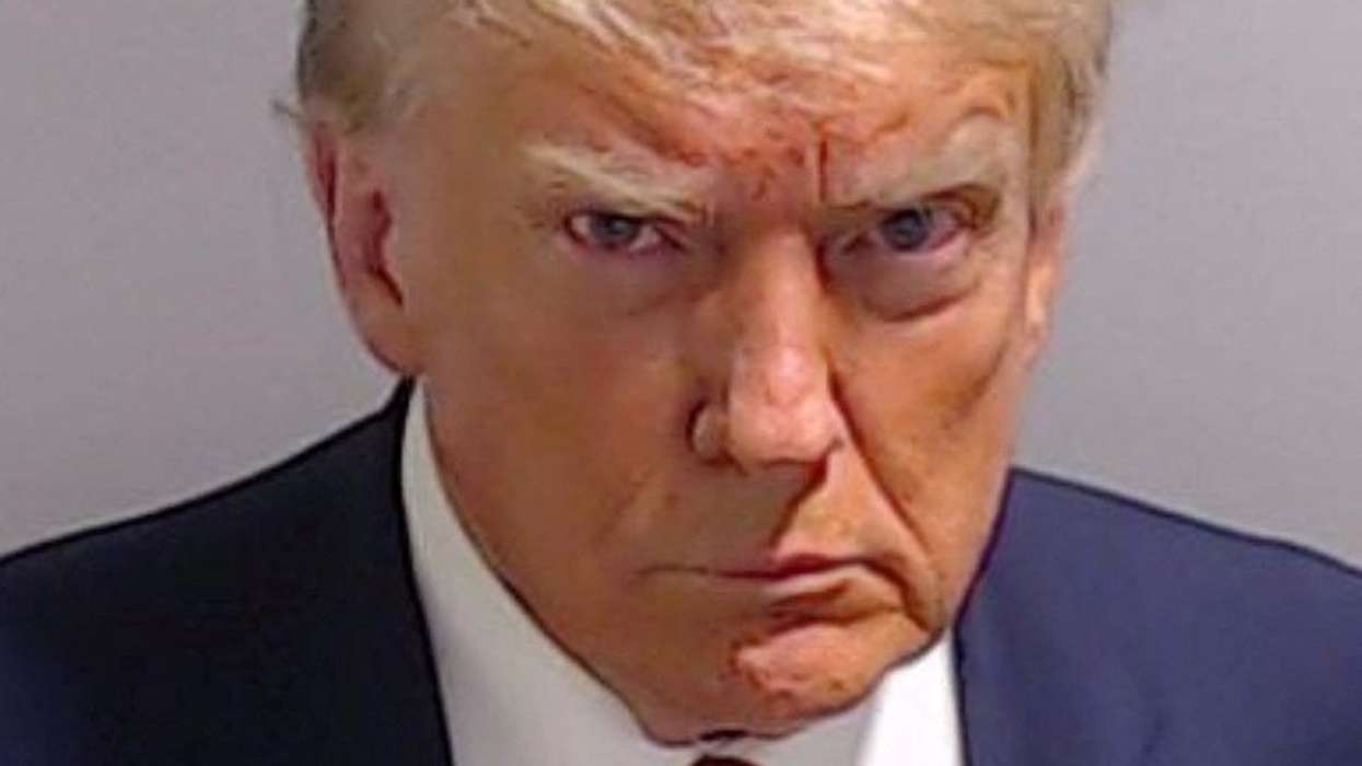 Trump arrested in election case, mug shot released