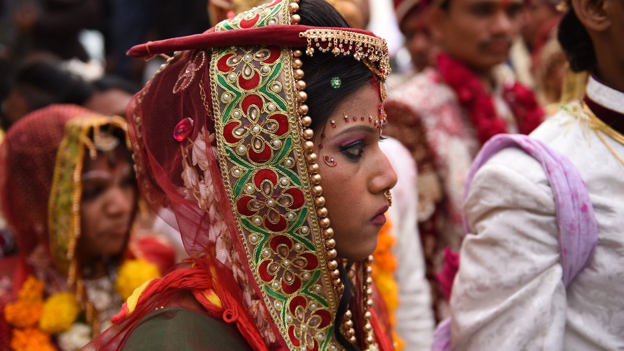 Tourists paying for tickets to attend Indian weddings