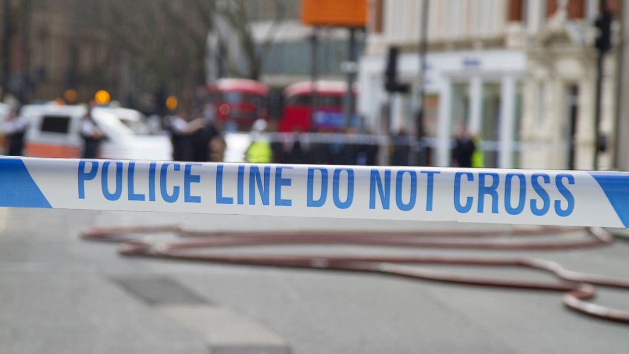 Woman injured after getting caught in crossfire