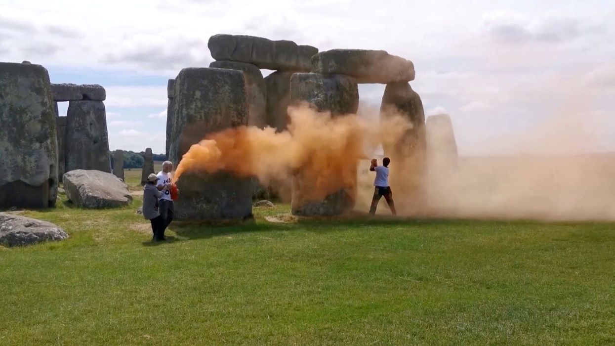Climate protesters target Stonehenge with orange paint