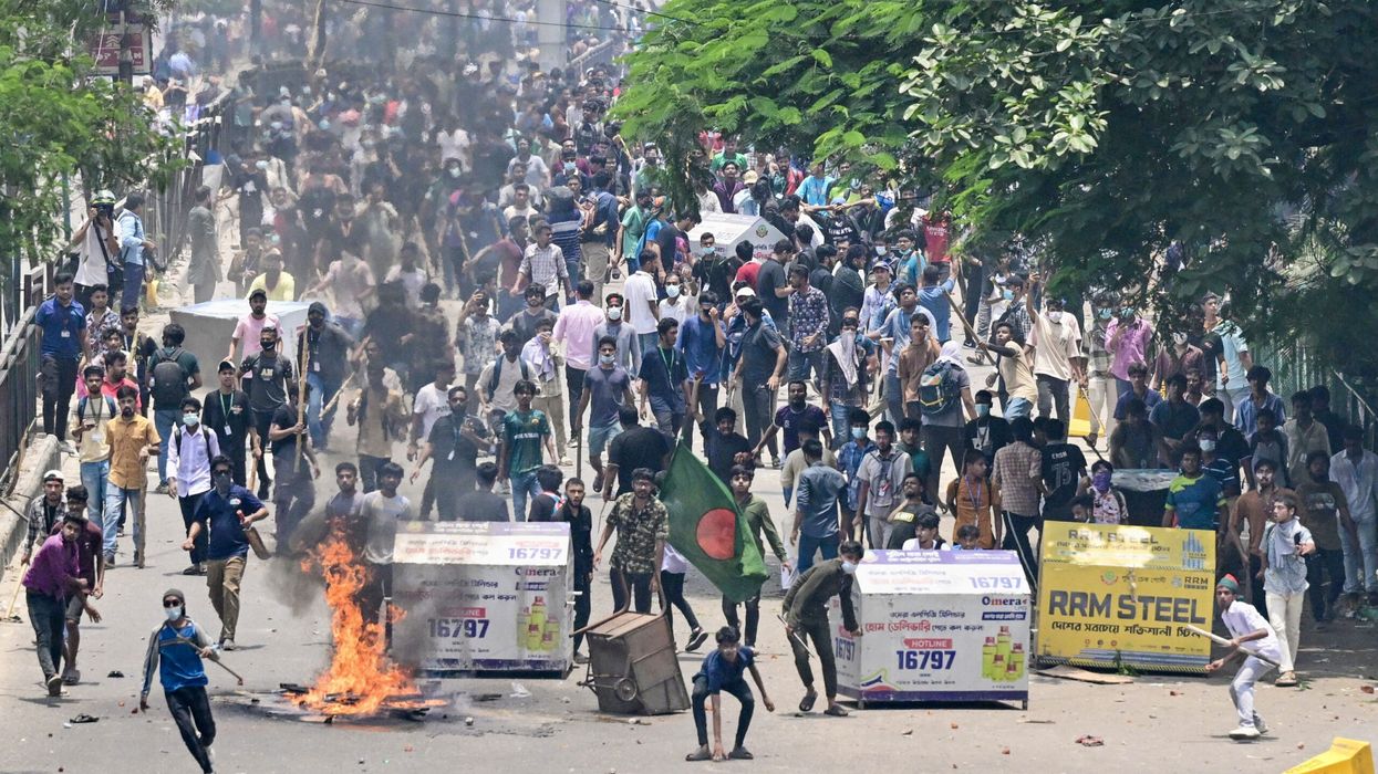 At least 100 killed in Bangladesh unrest as soldiers patrol cities