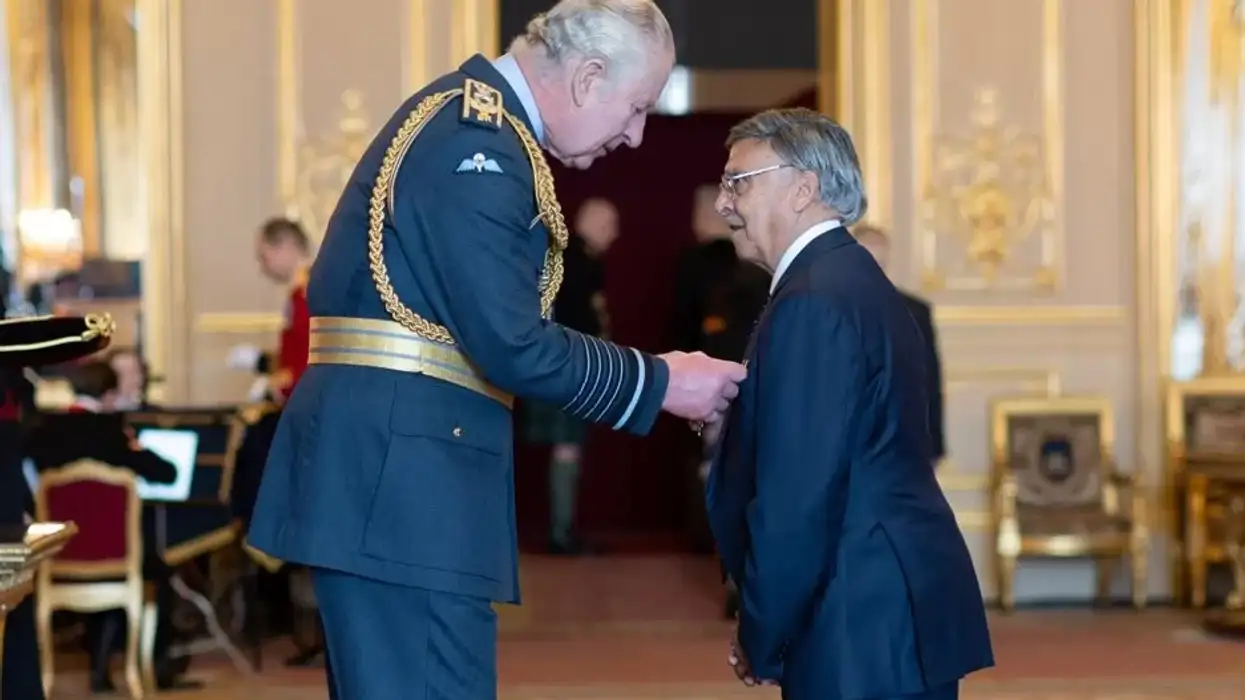 Vinu Bhattessa receives OBE from King Charles