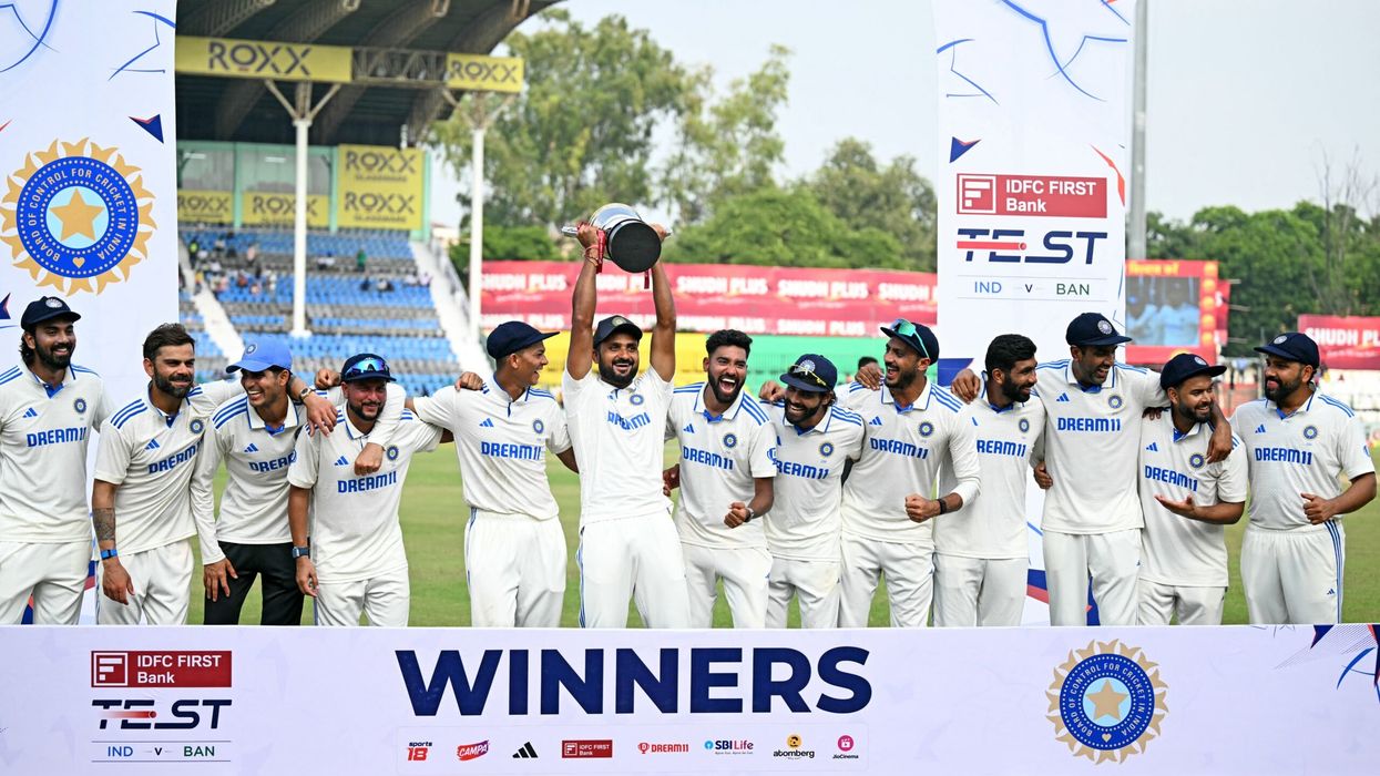 India's players celebrate with their trophy at the end of the second Test against Bangladesh in Kanpur on October 1, 2024. (Photo: Getty Images)