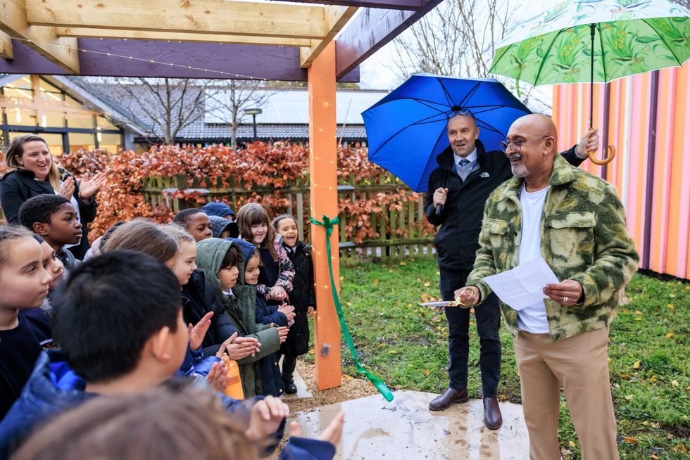 INSET 3 EE Garden in Battersea school Manoj Malde cutting ribbon. Headteacher Jared Brading behind him 12 December 2023 1