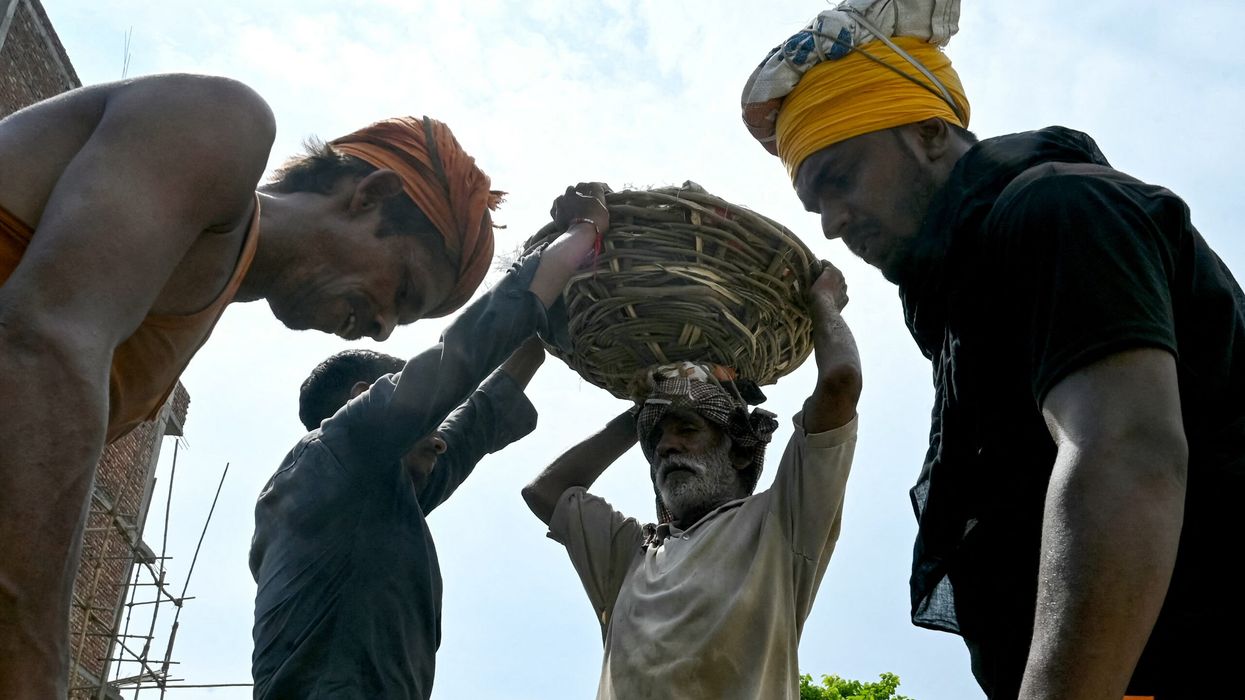 Labourers work at a construction site in India's Amritsar city on August 28, 2024. (Photo: Getty Images)