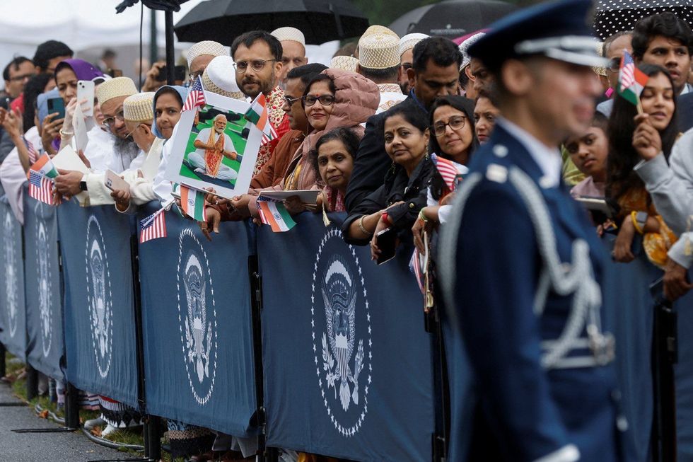 LEAD Amit INSET 2 Indian Americans wait at White House