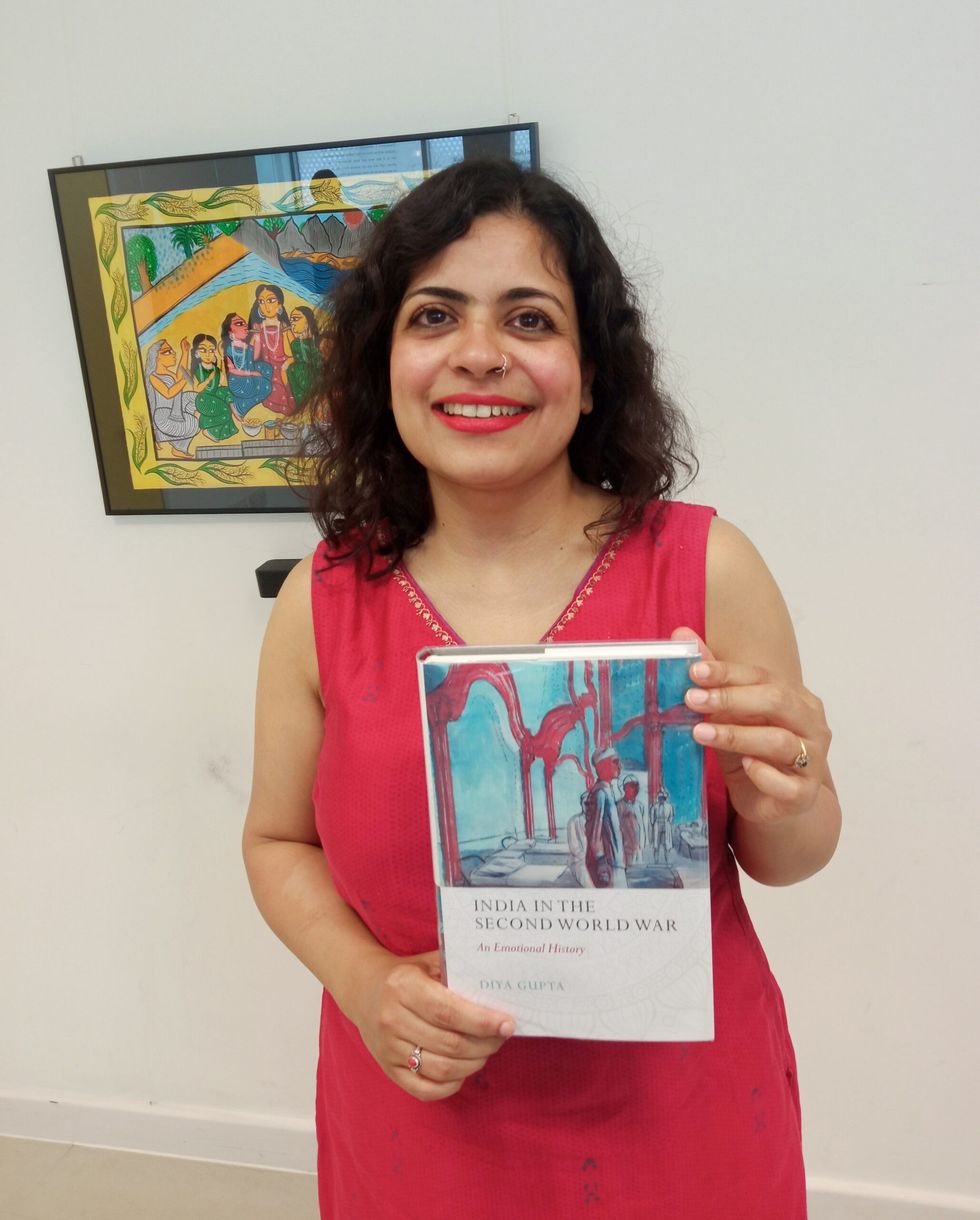 LEAD Inset 2 Hunger Burns. Diya Gupta with her book 27 May 2024