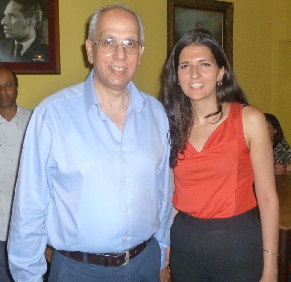 LEAD Yadgar Marker and his daughter Phiroza in front of a portrait of Krishna Menon at the India Club